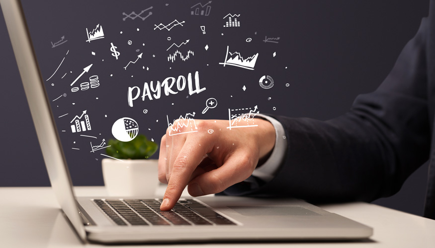 Businessman working on laptop with PAYROLL inscription, modern business concept