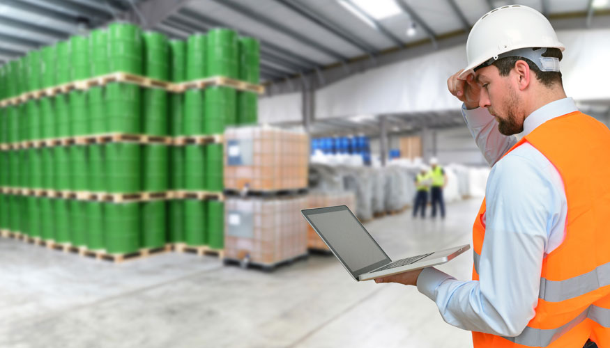 Manager of a logistics company in the front of a warehouse