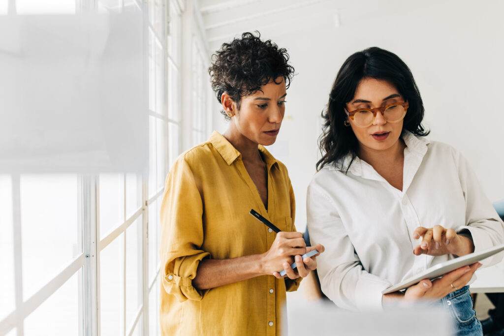 Two business women having a discussion.