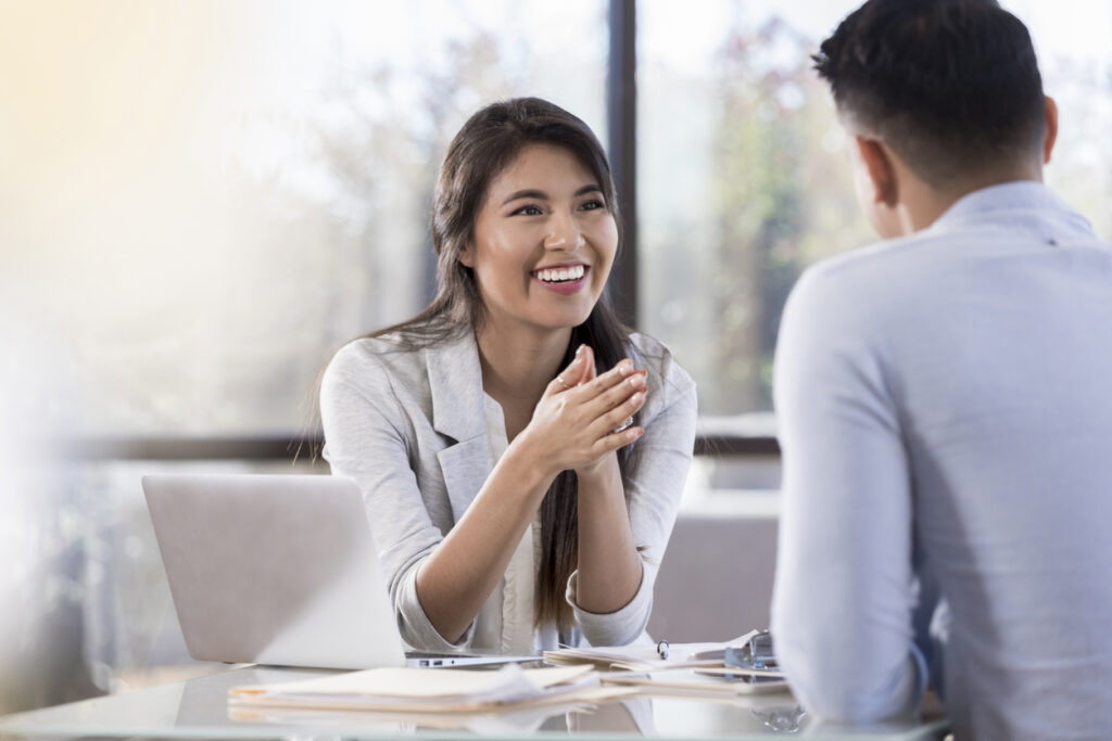 Business woman explaining something to a client.