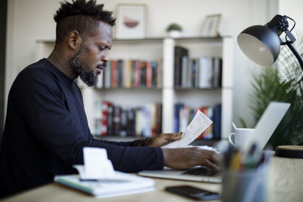 Man using QuickBooks Payroll