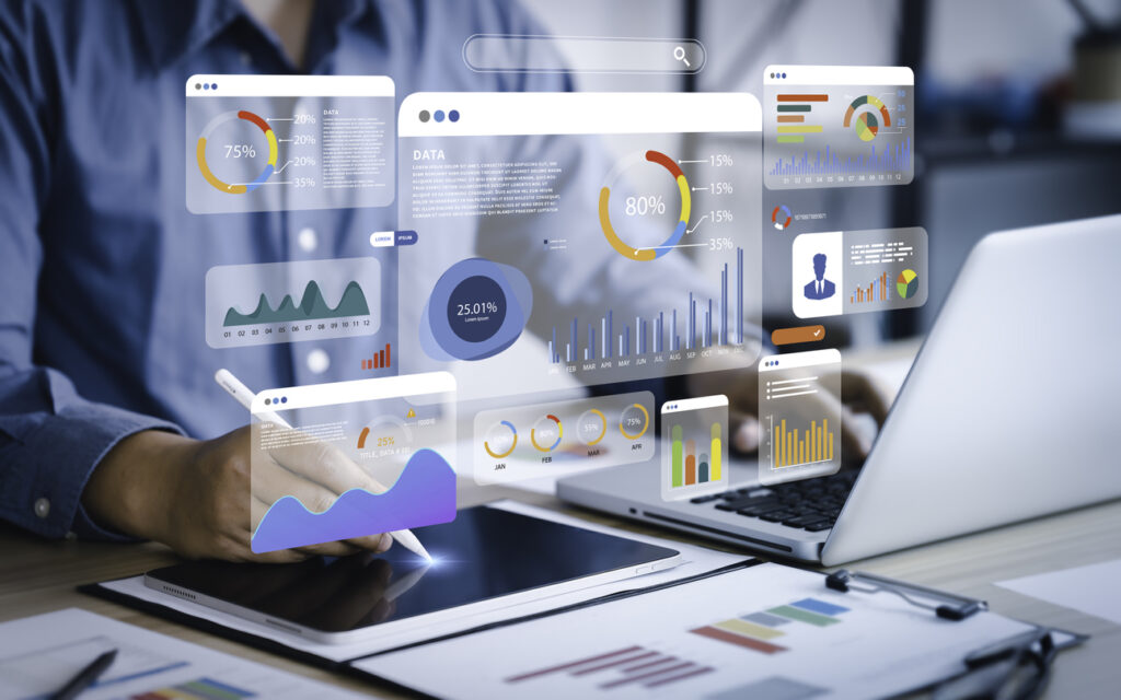 An analyst uses a computer and dashboard for data business analysis.